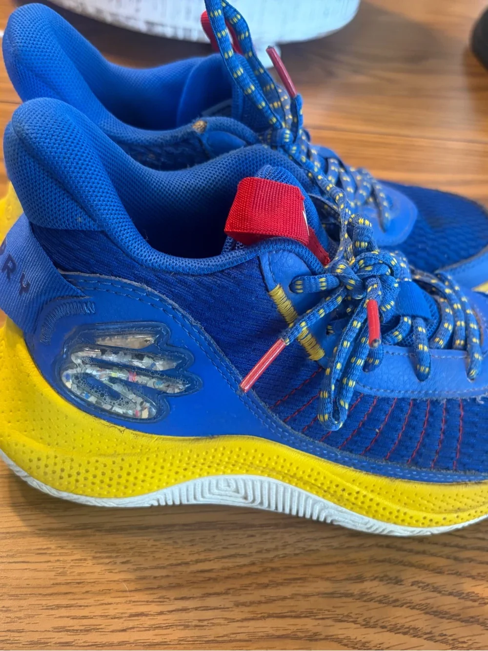 Under Armour Kids Blue Sneakers with Yellow and Red Accents